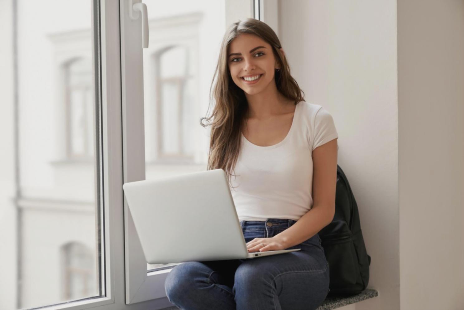 Student analyzing keyword research data on laptop